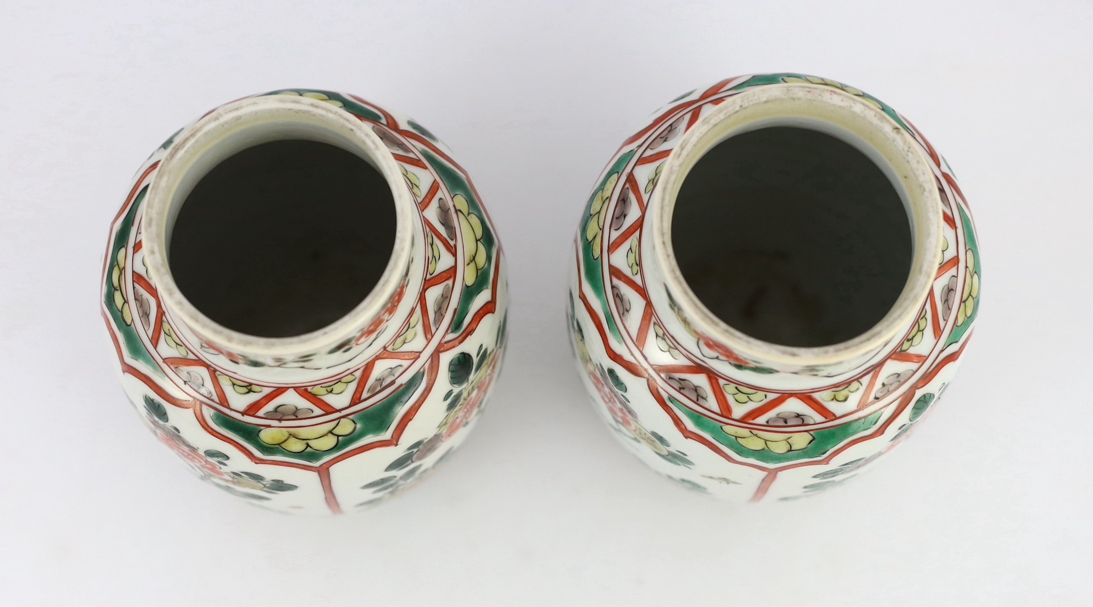 A pair of Chinese famille verte small jars, Kangxi period, 15.5cm high, rim crack
